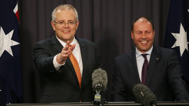 Mr Morrison and Mr Frydenberg have a laugh with the media during the press conference in Parliament House in Canberra. Picture: Gary Ramage