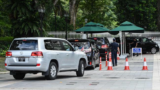 A convoy carrying the delegation led by Nancy Pelosi arrives at the Istana presidential palace in Singapore on Monday. Picture: AFP