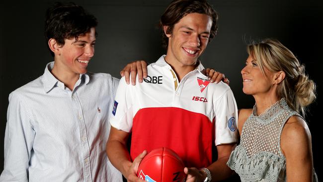 Oliver Florent his brother Jai and mother Rachael after being drafted by Sydney. Picture: Jonathan Ng