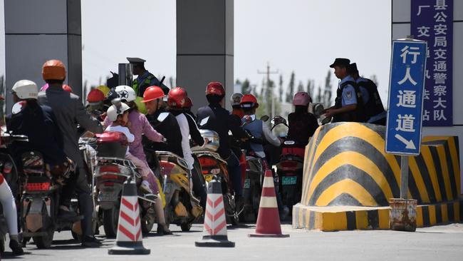 A police checkpoint on a road near a facility believed to be a re-education camp where mostly Muslim ethnic minorities are detained. Picture: AFP