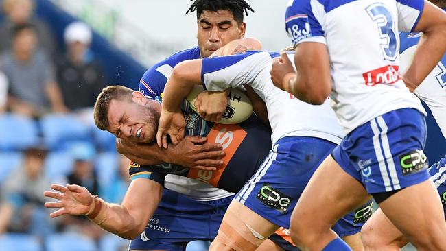 Jai Arrow feeks the heat from the Bulldogs defence. Picture: AAP Image/Dave Hunt