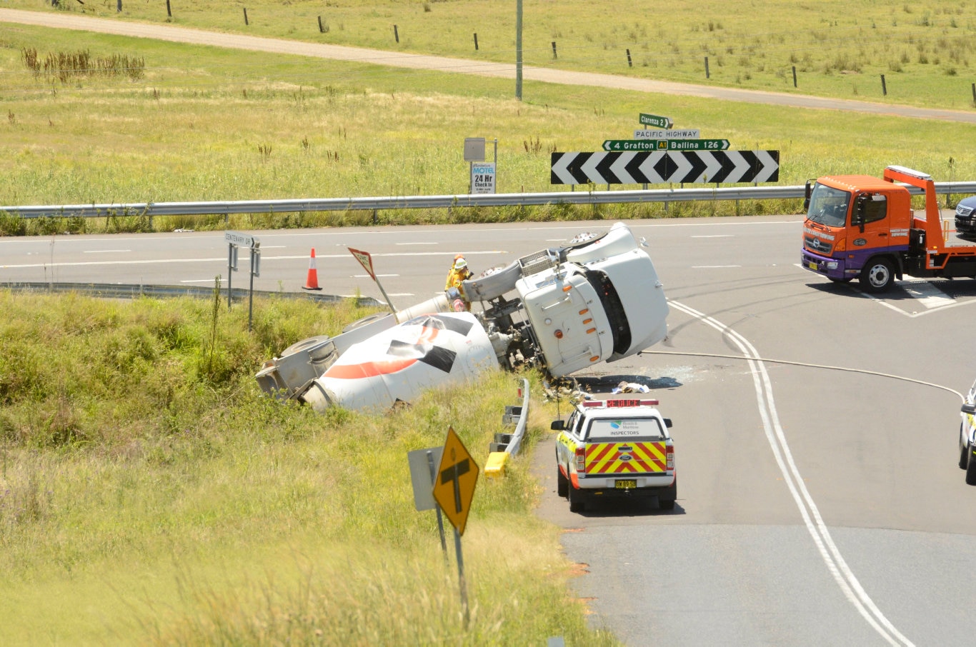 A cement truck came to rest in a ditch near the Pacific Highway, Centenary Drive intersection, north of Grafton, NSW. Picture: Jarrard Potter