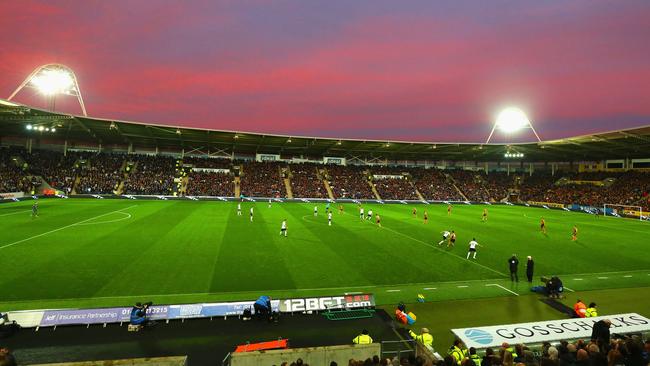 KC Stadium under sun set.