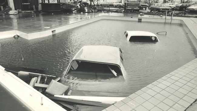 Cars were carried into the pool of the Darwin Travelodge by Cyclone Tracy. This picture appeared on page 4 of The Australian on Friday, December 27, 1974. Picture: Bob Seary