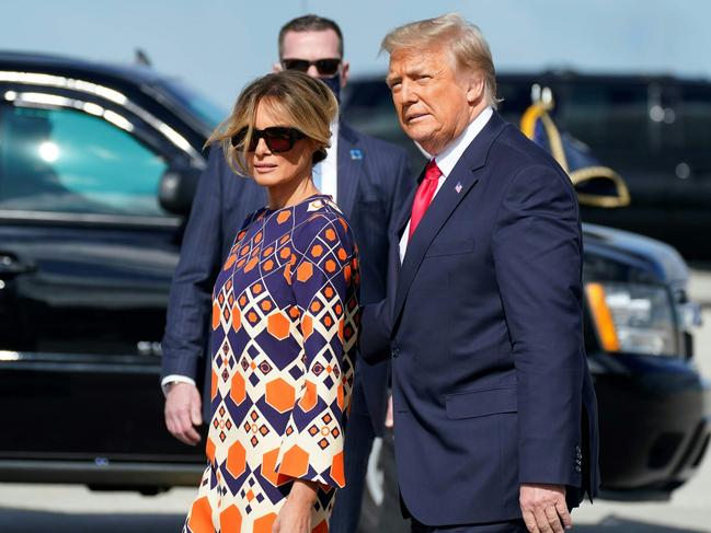 Donald Trump and Melania arrive at Palm Beach International Airport after leaving the White House. Picture: Alex Edelman/AFP