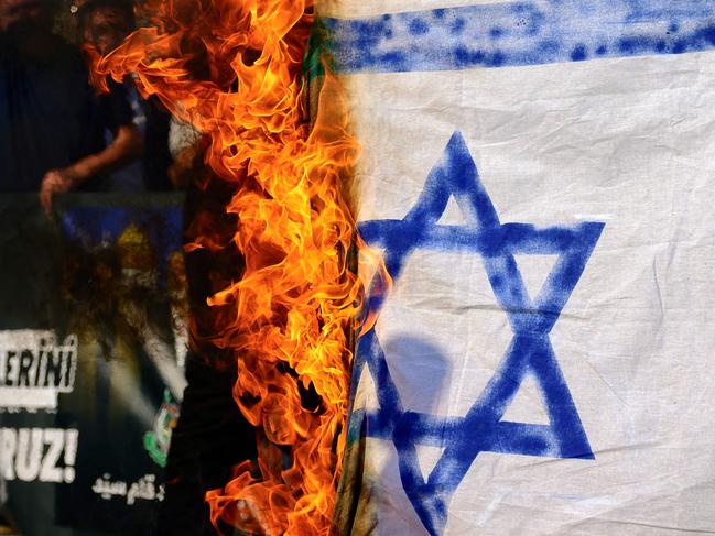 Demonstrators burn a homemade Israeli flag during a protest rally in the front of Israeli Consulate in Istanbul. Picture: AFP