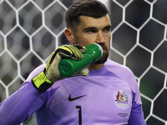 ARLINGTON, TEXAS - SEPTEMBER 9: Mat Ryan #1 of Australia hydrates during a pause in the action against Mexico during the second half of a 2023 International Friendly match at AT&T Stadium on September 9, 2023 in Arlington, Texas. (Photo by Ron Jenkins/Getty Images)