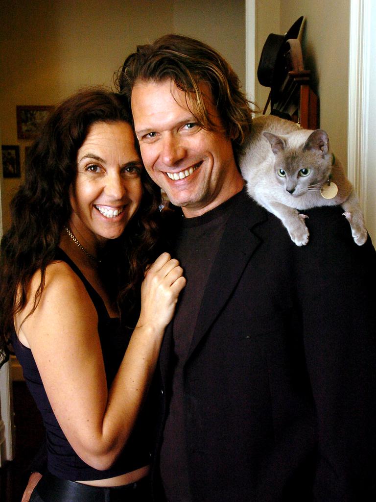 Janine Allis and Jeff Allis with their cat Ash at home in Melbourne.