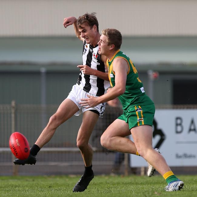 Leongatha’s Jenson Garnham bumps Sale opponent Hudson Holmes, Picture: Yuri Kouzmin