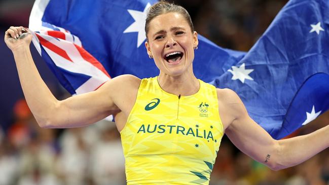 PARIS, FRANCE - AUGUST 07: Nina Kennedy of Team Australia celebrates winning the gold medal after competing in the Women's Pole Vault Final on day twelve of the Olympic Games Paris 2024 at Stade de France on August 07, 2024 in Paris, France. (Photo by Cameron Spencer/Getty Images)