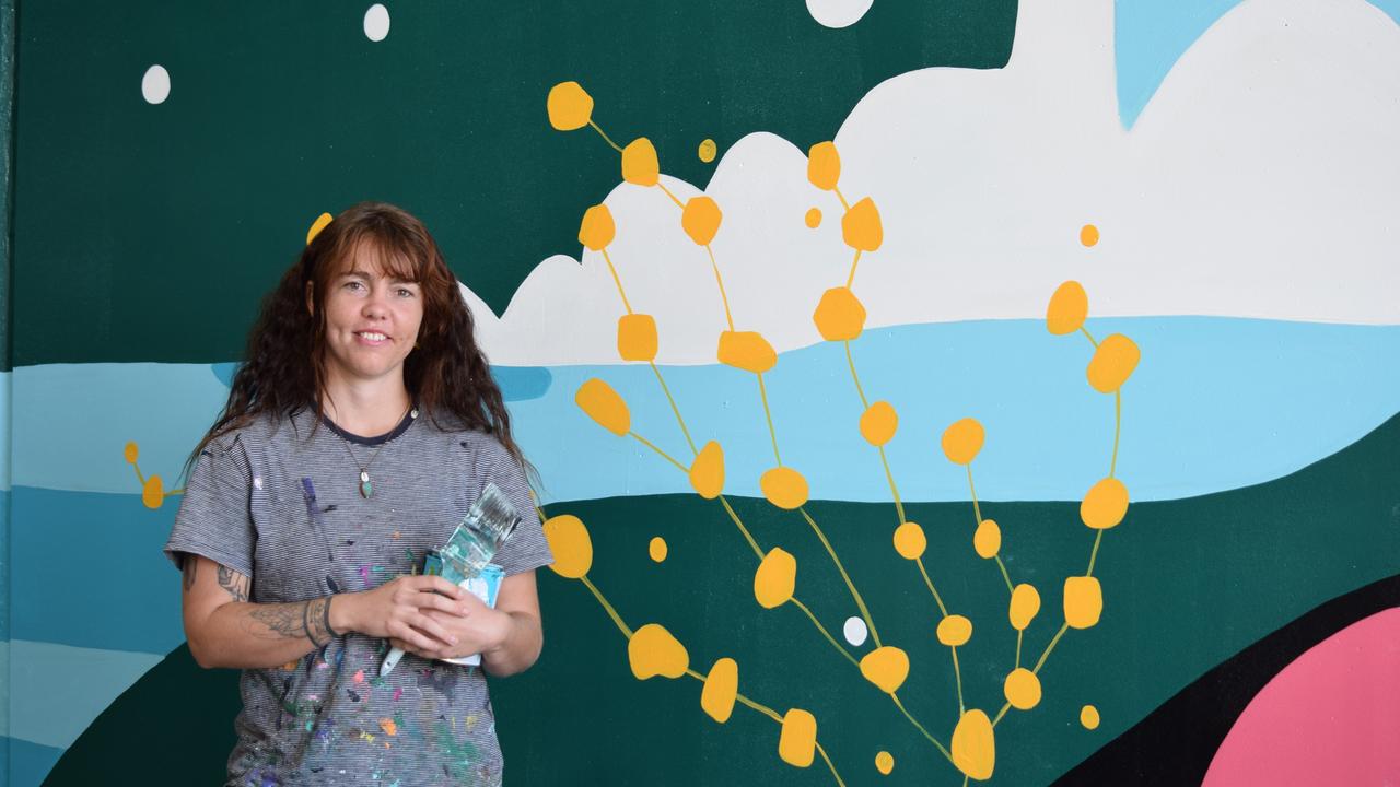 Mural artist Katie Richardson with part of her latest mural