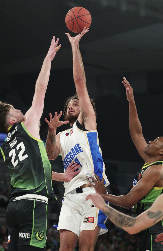 Bullets big Tyrell Harrison shoots under pressure from Matt Hurt and Malique Lewis. Picture: Getty Images