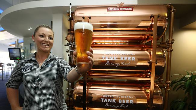 Tallebudgera SLSC operations manager Sharna De Groot with the new tank beer from Carlton. Picture: Glenn Hampson.