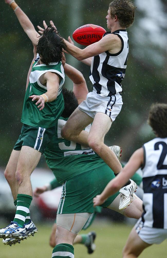 Nick Hind climbs for a hanger while playing in the Central Highlands league for Clunes.