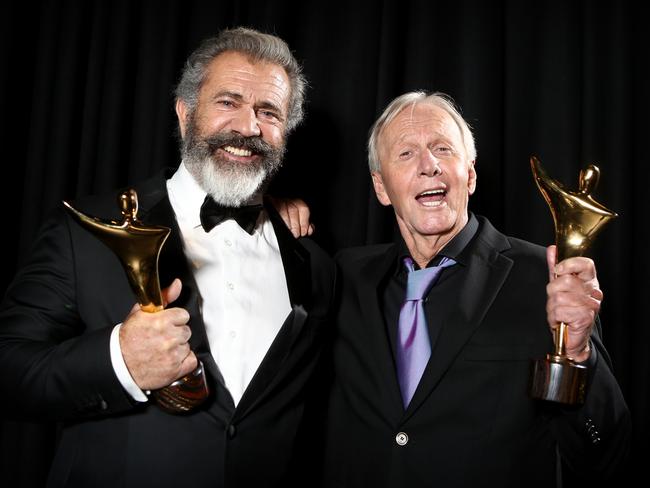 Mel Gibson and Paul Hogan backstage celebrating their AACTA wins. Picture: Chris Pavlich