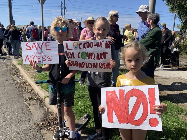 05/11/2022 Hundreds of residents gather at the Champion Rd rail crossing in Newport on Saturday to protest the State Government's planned closing of the crossing. These young people make their thoughts known on the planned closure of the Champion Rd rail crossing in Newport.