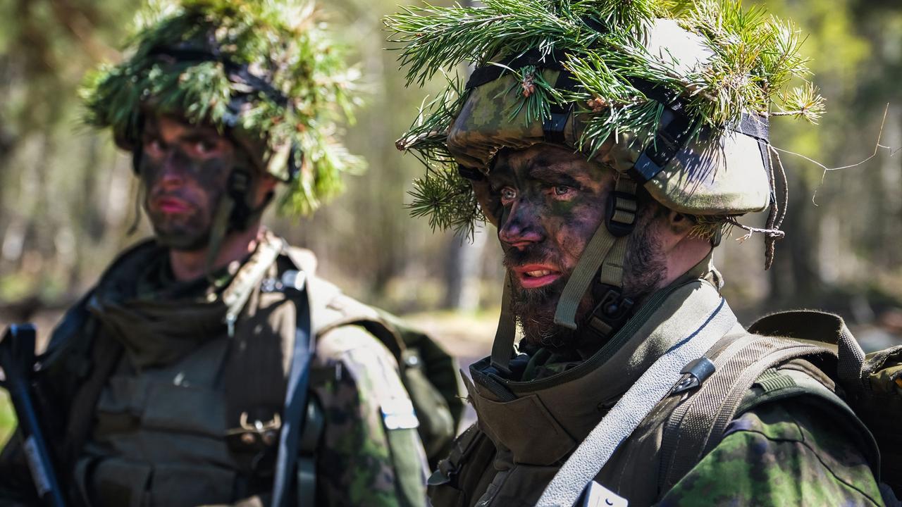 Members of the MPK, the National Defence Training Association of Finland, attend a training at the Santahamina military base in Helsinki, Finland on May 14, 2022. (Photo by Alessandro RAMPAZZO / AFP)