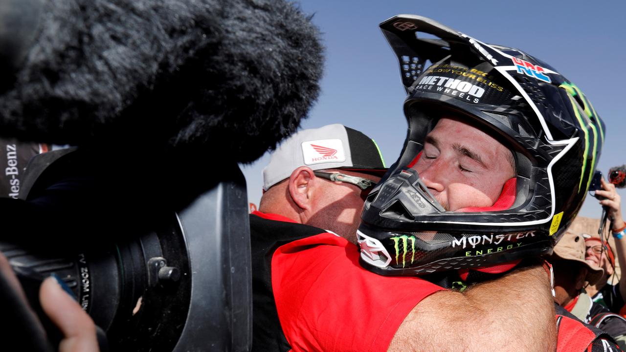 Ricky Brabec is congratueld at the end of stage 12. (Photo by FRANCK FIFE / AFP)