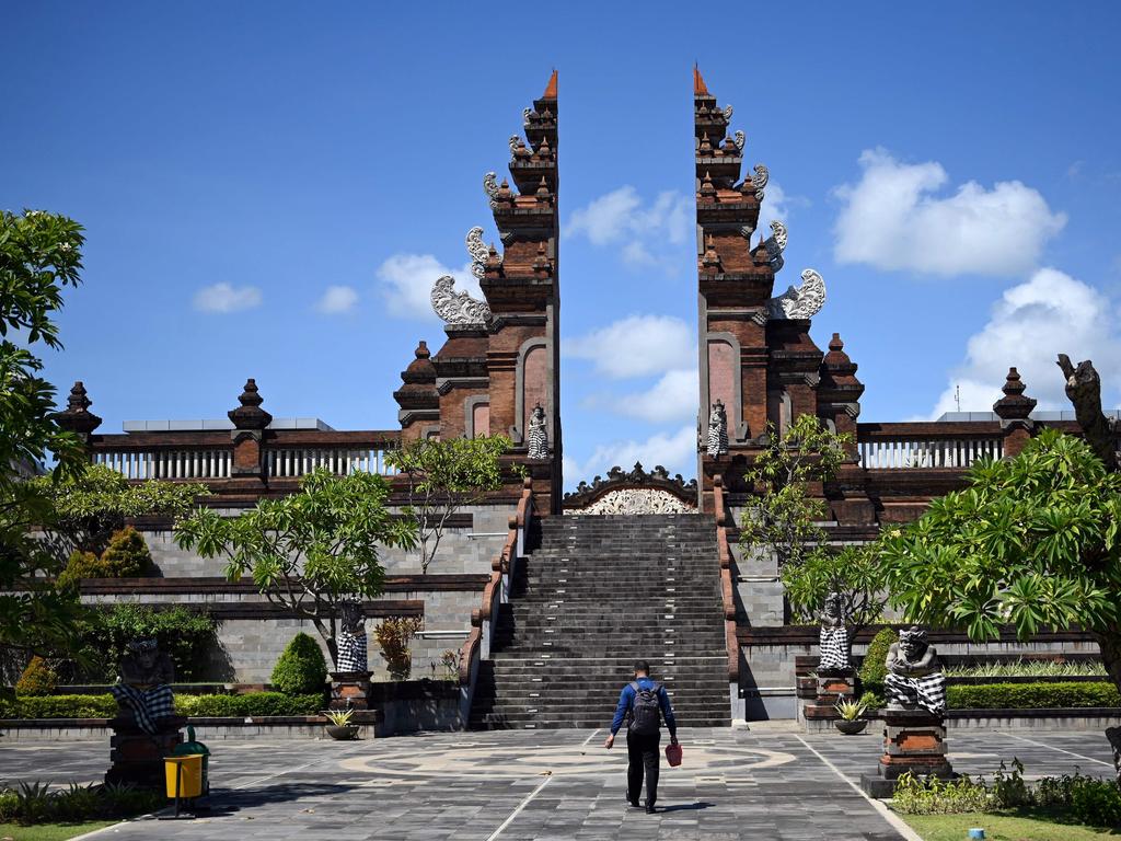 A man walks outside the domestic arrivals terminal at Ngurah Rai International airport near Denpasar. Picture: AFP