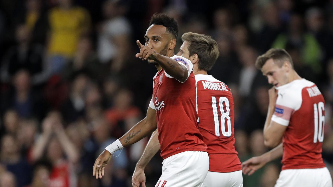 Arsenal's Pierre-Emerick Aubameyang, left, celebrates after scoring the opening goal