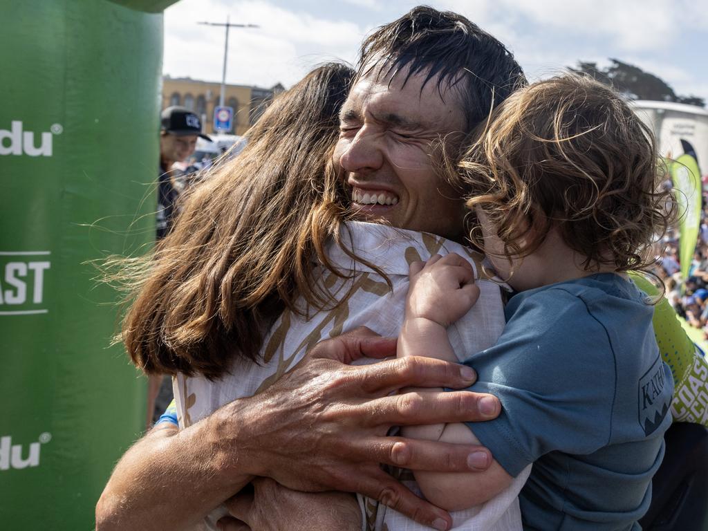 Alex Hunt gets a hug from his family after his victory. Picture: Iain McGregor/Coast to Coast