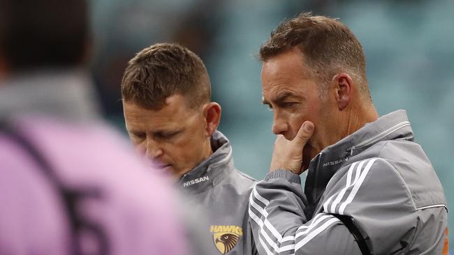 Hawks coach Alastair Clarkson chats to Brendon Bolton during their clash with Sydney. Picture: Getty Images