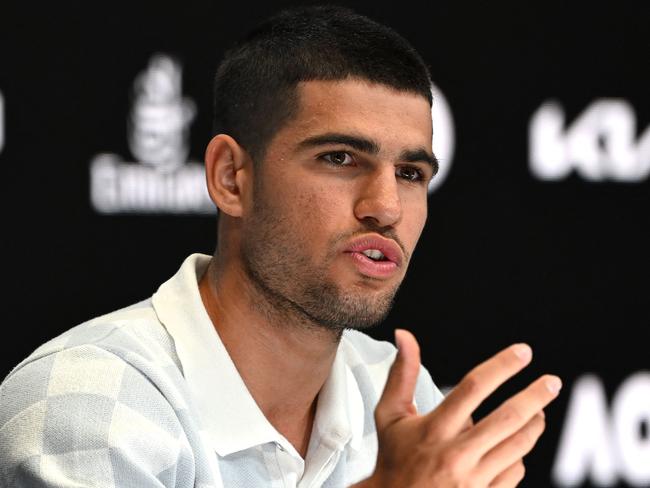 Spain's Carlos Alcaraz speaks at a press conference ahead of the Australian Open in Melbourne on January 11, 2025. (Photo by Yuichi YAMAZAKI / AFP) / – IMAGE RESTRICTED TO EDITORIAL USE – STRICTLY NO COMMERCIAL USE –