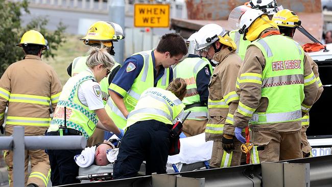 Emergency workers remove the person trapped in the car after the 2018 crash. Picture: SAM ROSEWARNE.