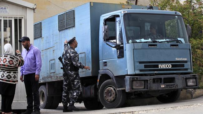 A police paddy wagon transports Australian kidnapping suspects Sally Faulkner, the mother of two Lebanese-Australian children, and Australian TV presenter Tara Brown to a women's prison, in the Beirut southeastern suburb of Baabda, Lebanon