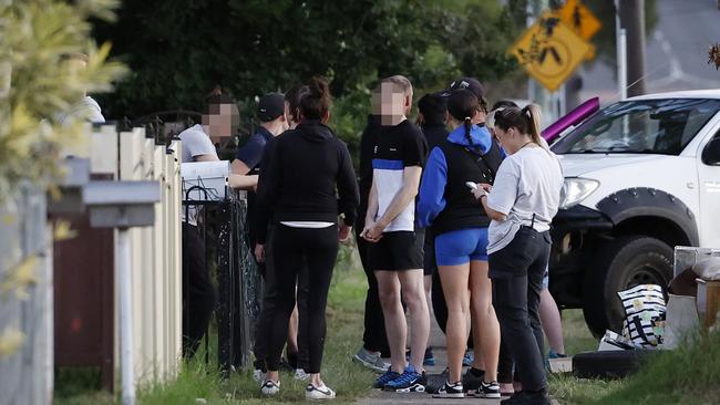 Detective talking to teens near the scene. Picture: Richard Dobson