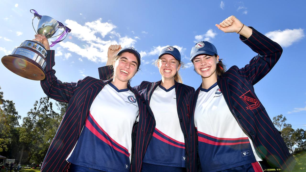 Sophie Malcom, middle, after helping BSHS win the Aggregate Cup at the QGSSSA cross country championships. She is also an elite rower. Picture, John Gass