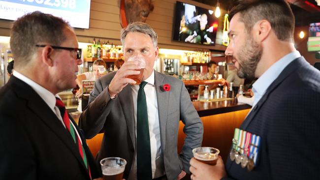 Richard Marles has a beer and a chat with MP for Solomon Luke Gosling and Afghanistan veteran Brent Potter. Picture: Tim Hunter.