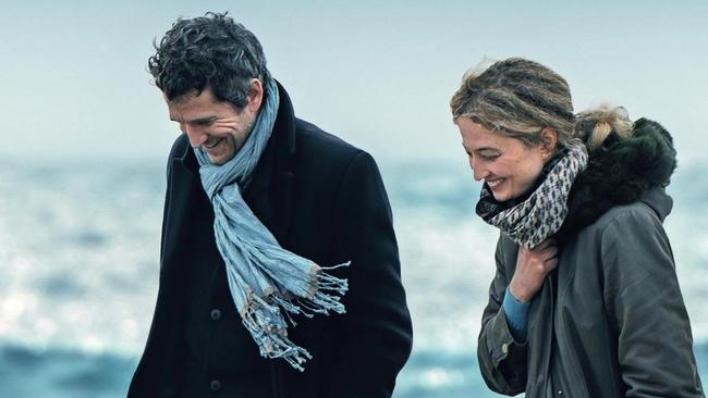 Laurent (Guillaume Canet) and Alice (Alba Rohrwacher) walk on the beach in Out of Season.