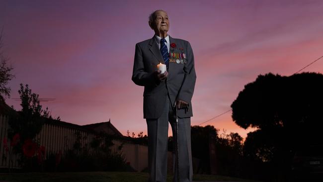 WWII veteran Jack Hair, 97, stands outside his home at dawn. Picture: AAP Image/Michael Dodge