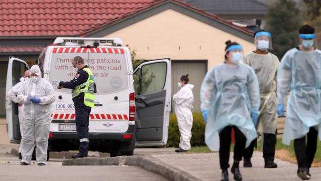 Aged care residents in Fawkner are taken to waiting ambulances after a COVID-19 outbreak. There are fears Victoria’s death toll will rise sharply this week. Picture: David Crosling