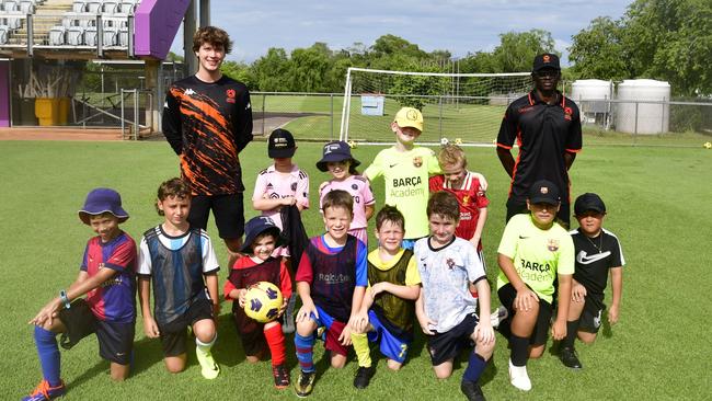 Coaches Ben and Taluga with future Territory soccer stars. Picture: Darcy Fitzgerald