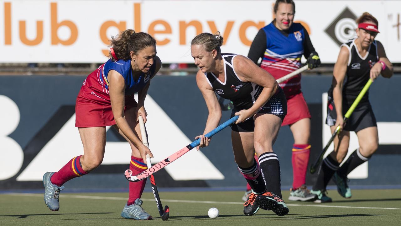 Carol McIntosh (left) of Brisbane 2 and Mackay 1 captain Ellen Crawford.