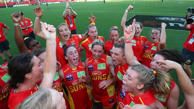 Suns celebrate winning the round 2 AFLW match between the Gold Coast Suns and the Richmond Tigers at Metricon Stadium on February 15, 2020 in Gold Coast, Australia. (Photo by Chris Hyde/AFL Photos/Getty Images)