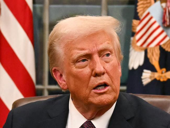 US President Donald Trump speaks to journalists about TikTok as he signs executive orders in the Oval Office of the White House in Washington, DC, on January 20, 2025. (Photo by Jim WATSON / POOL / AFP)