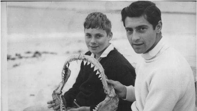 Raymond Short, left, with the jaws of the shark that attacked him at Coledale beach in 1966 when he was 13.