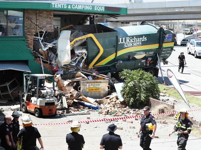 Fatal accident after a rubbish truck crashed into Tentworld on the corner of Northey St and Lutwyche Rd, Windsor. Picture: Liam Kidston