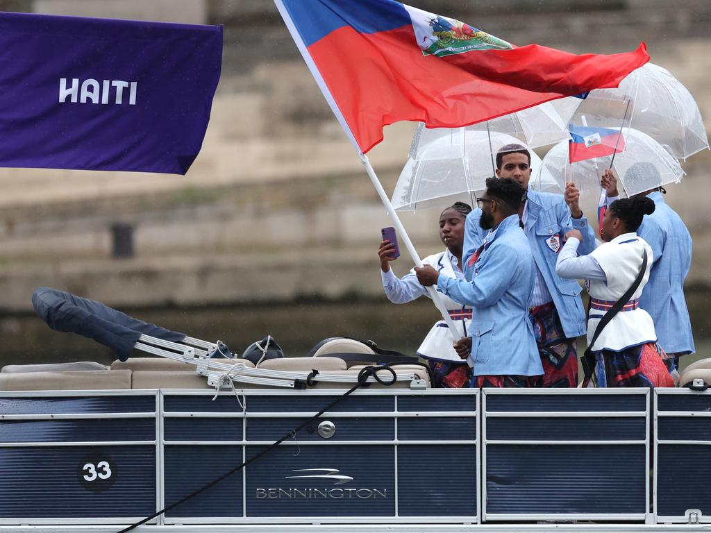 Team Haiti athletes are seen cruising along the River Seine during the opening ceremony of the Olympic Games. Picture: Getty Images