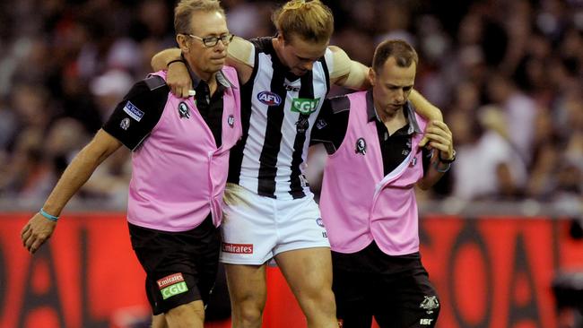 Ben Sinclair hobbles off Etihad Stadium.