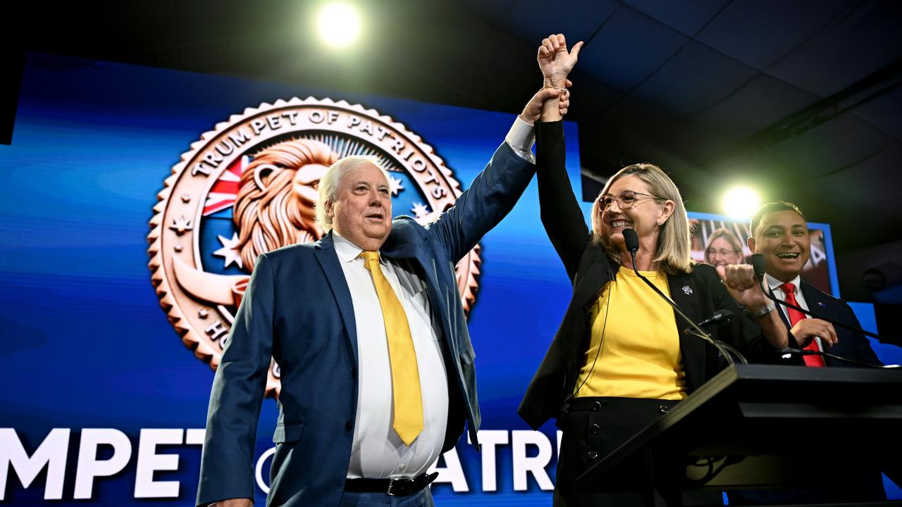 Australian businessman Clive Palmer and the leader of the Trumpet of Patriots party Suellen Wrightson celebrate during the federal election campaign launch of their 'Trumpet of Patriots' party. Picture: Getty