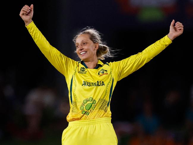 Australia's Ashleigh Gardner celebrates after the dismissal of New Zealand's Eden Carson (not seen) during the Group A T20 women's World Cup cricket match between Australia and New Zealand at Boland Park in Paarl on February 11, 2023. (Photo by Marco Longari / AFP)