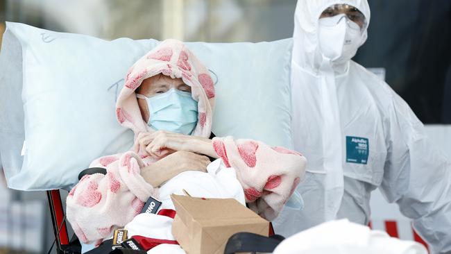 A resident of Epping Gardens Aged Care Facility is taken away in a ambulance on Tuesday. Picture: Getty Images