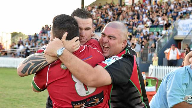 CHAMPIONS: Hervey Bay Seagulls Will Elemani (red), coach Tye Ingebrigtsen (centre) and Nathan McGrath celebrate their Bundaberg Rugby League grand final win over The Waves Tigers. Picture: Matthew McInerney