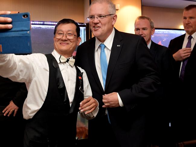 Prime Minister Scott Morrison poses for photographs with supporters at the Golden Century ahead of the 2019 Federal Election. Picture: Tracey Nearmy