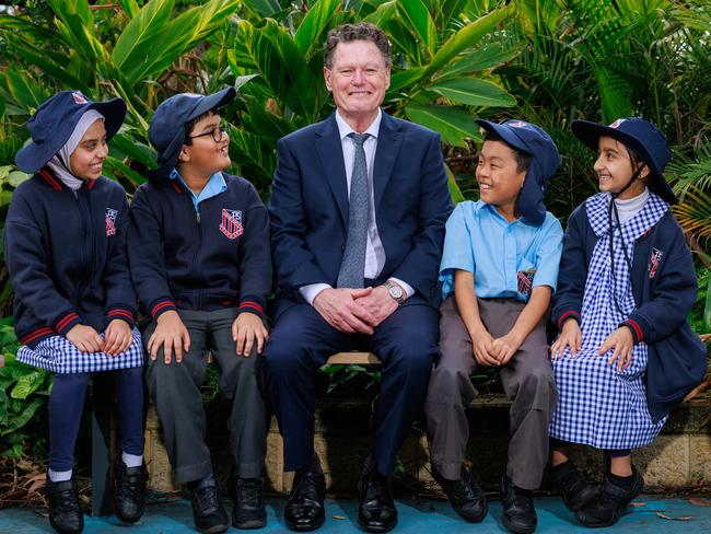 Principal Mark Harris with four of his students at Auburn North Public School. Picture: Justin Lloyd