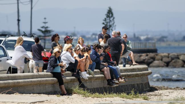 Locals watch on. Picture: David Geraghty